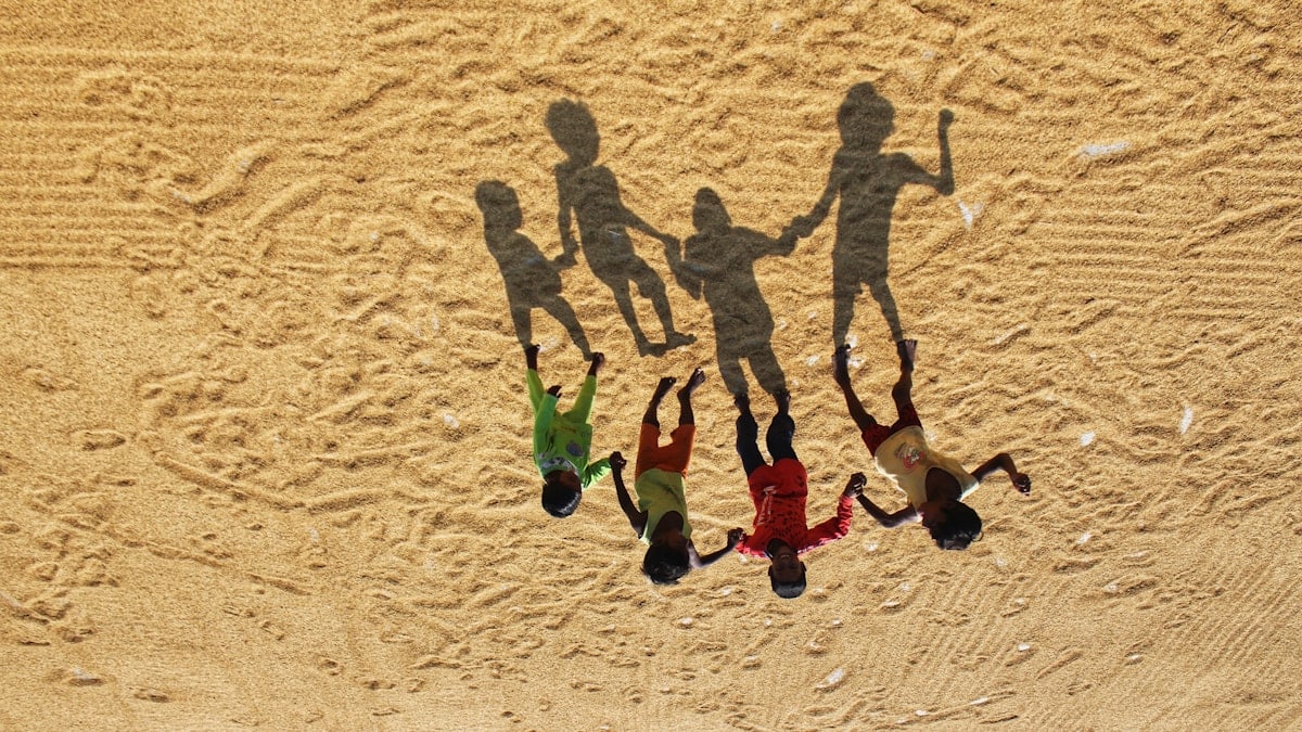 people walking on sand during daytime